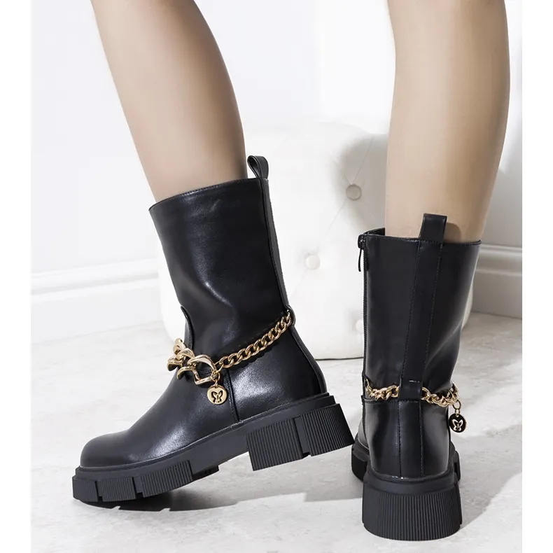 Black insulated boots with a gold Marsha chain