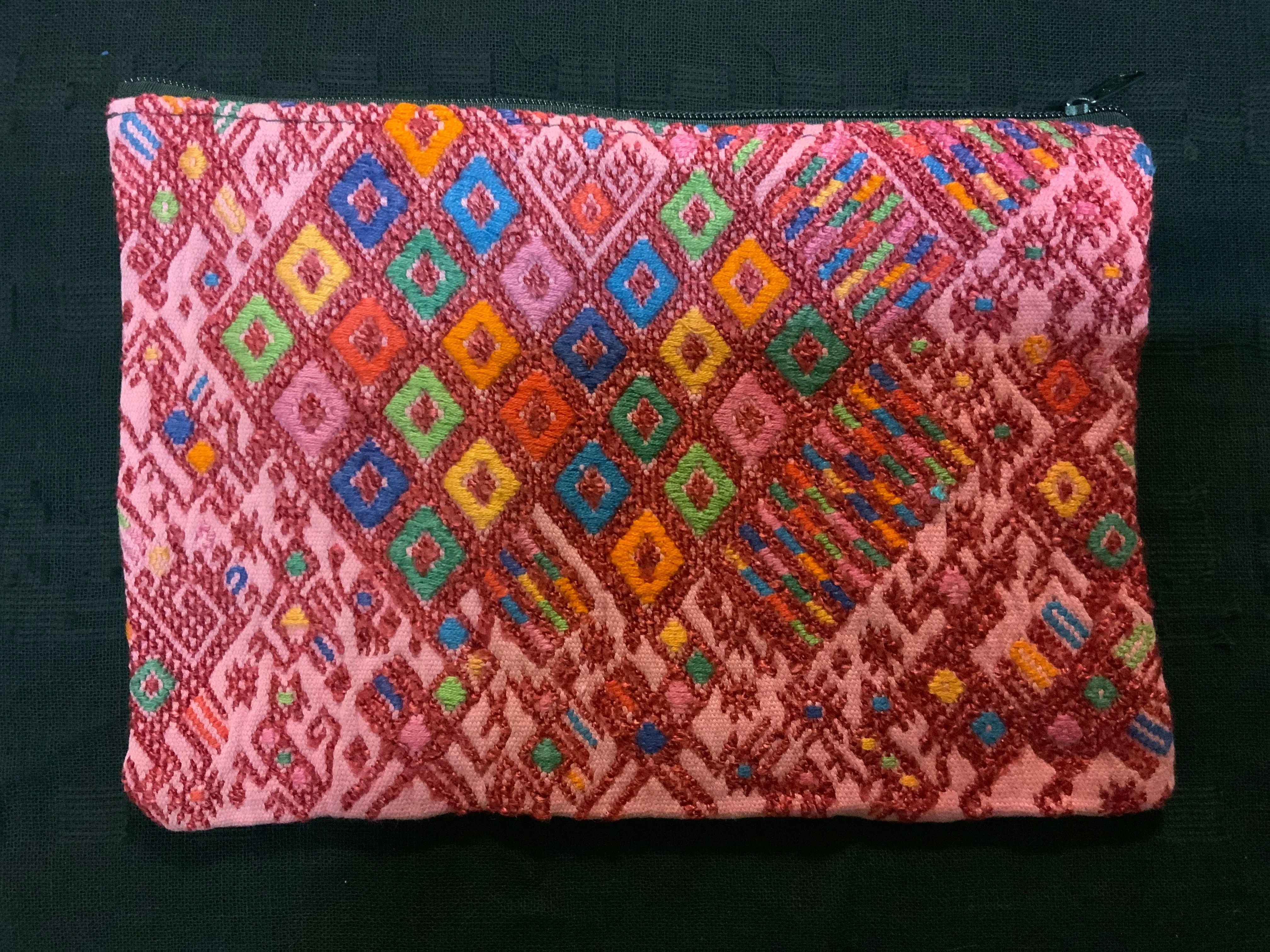 Guatemalan vintage fabric (embroidered) made into a 7” x 10” fully lined bag with zipper.  Both sides are of the same fabric.