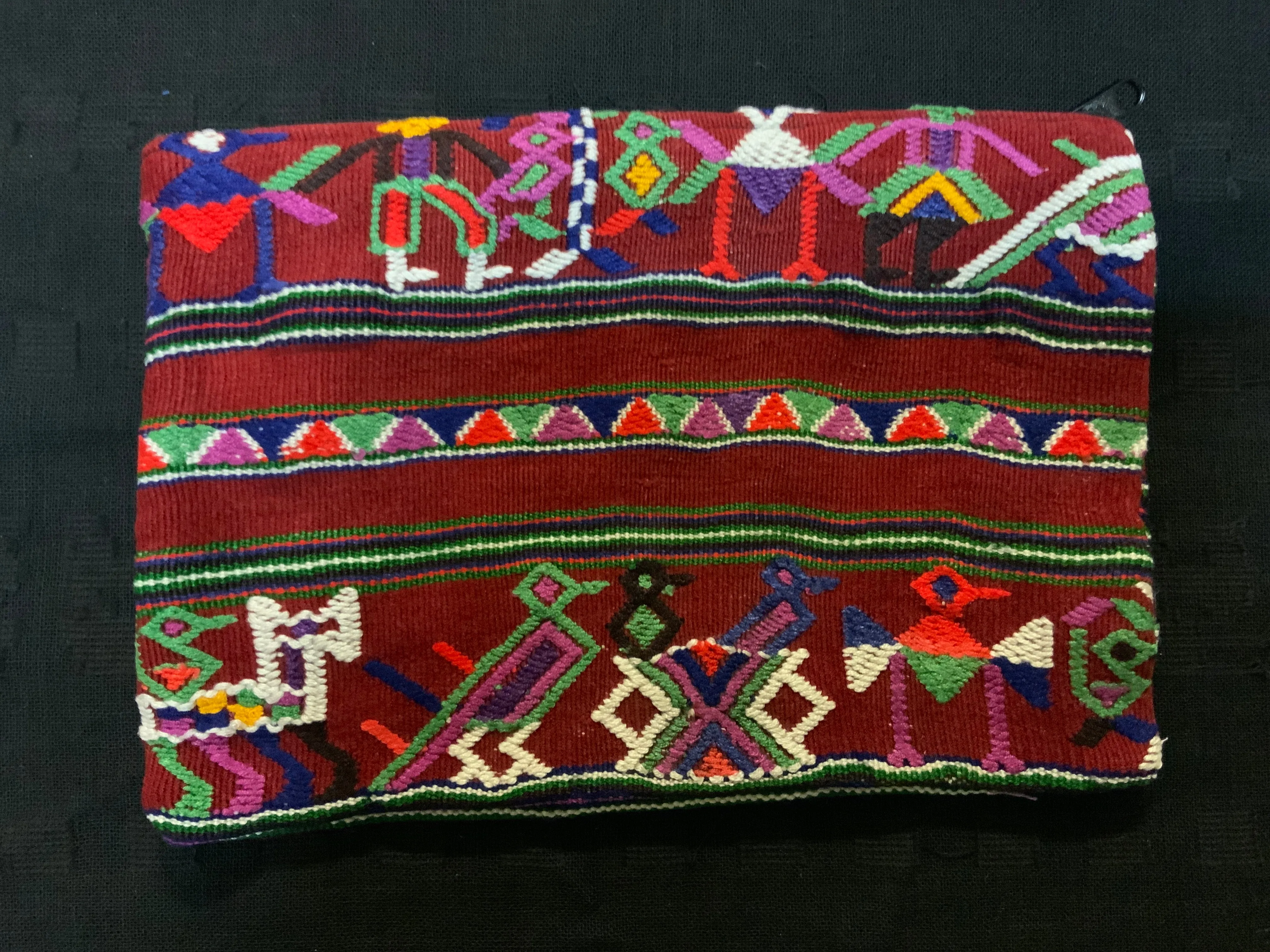 Guatemalan vintage fabric (embroidered) made into a 7” x 10” fully lined bag with zipper.  Both sides are of the same fabric.