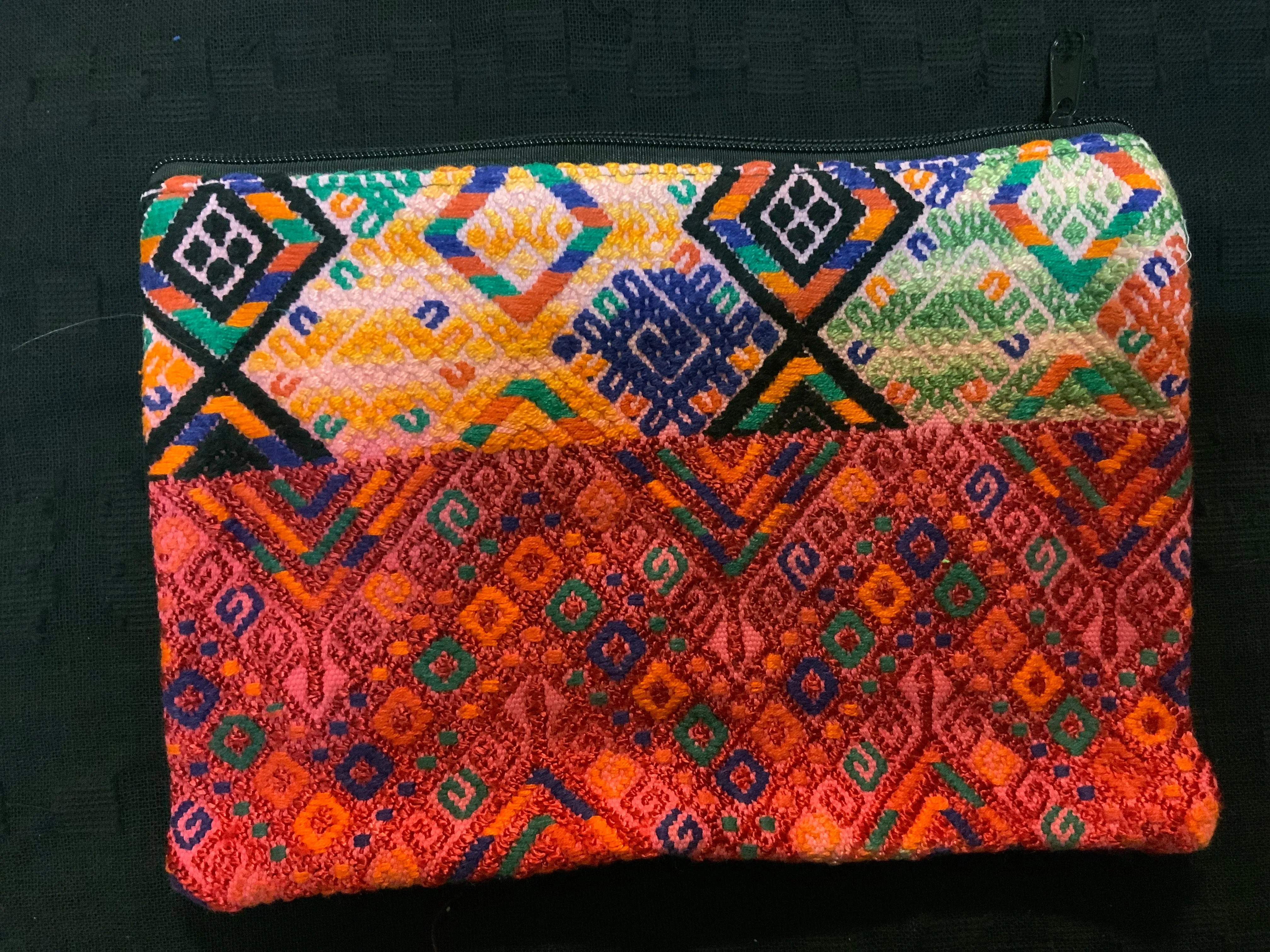 Guatemalan vintage fabric (embroidered) made into a 7” x 10” fully lined bag with zipper.  Both sides are of the same fabric.